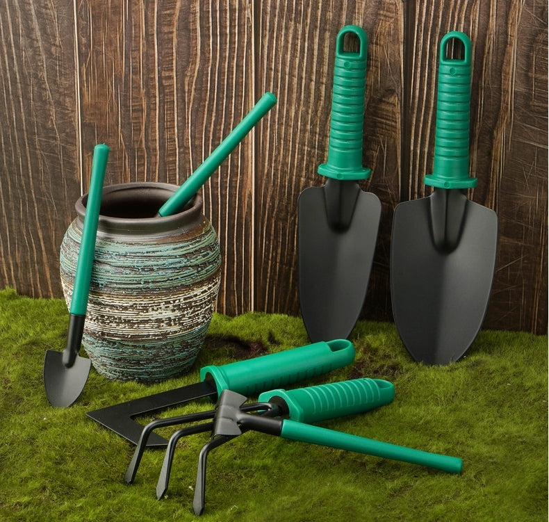 Dark green gardening tools