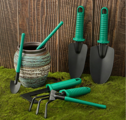 Dark green gardening tools